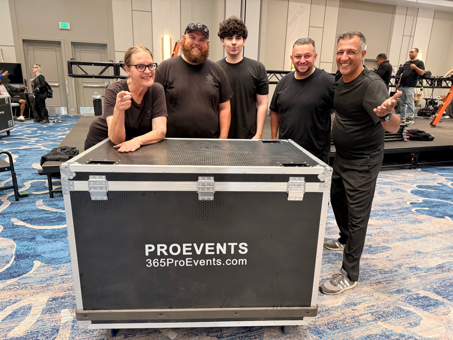 365 Pro Events crew with branded road case at hotel ballroom load-in